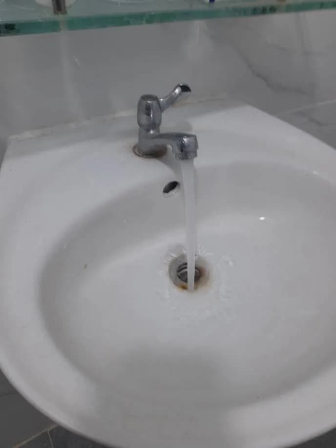Sau khi hoàn thành sửa bồn nước và vòi nước tại Tân Bình — thợ Trần Lào